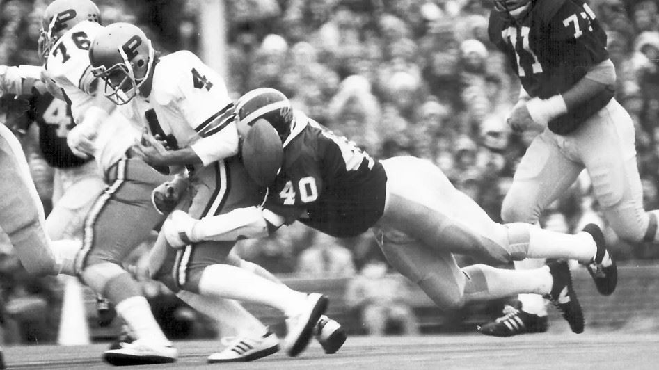  Ron Simpkins tackling a player causing a fumble